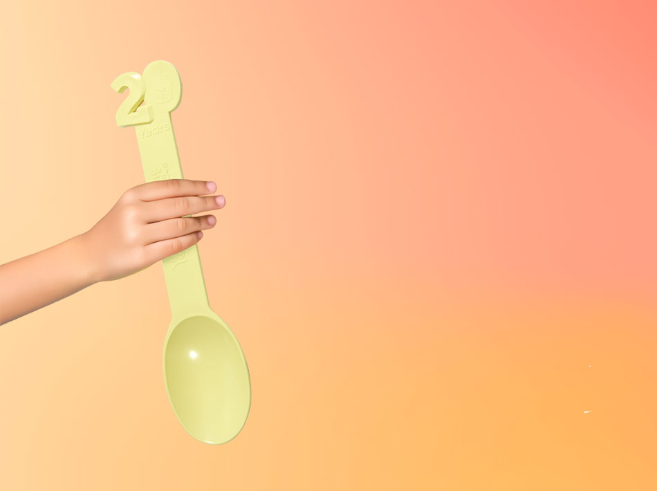 A Yogurtland Butter Yellow Spoon