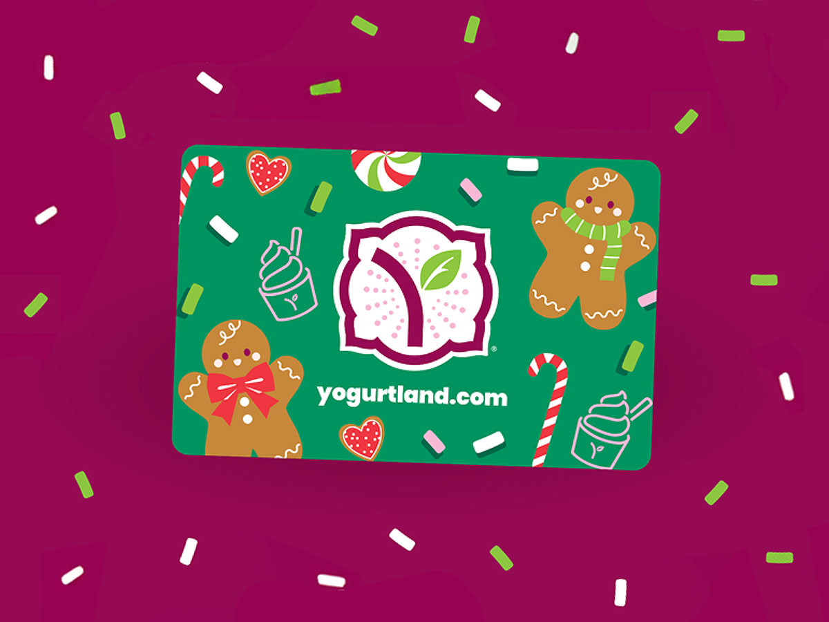 A group of Yogurtland cups of frozen yogurt and toppings