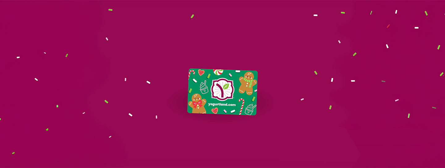 A group of Yogurtland cups of frozen yogurt and toppings