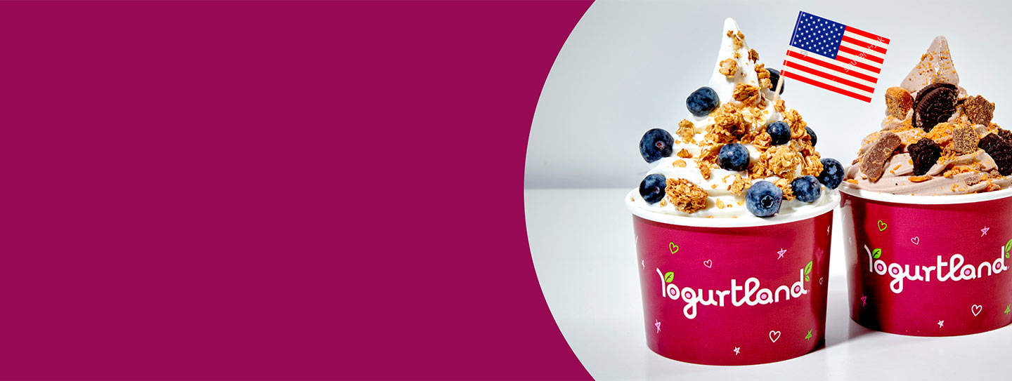 Two Yogurtland frozen yogurt cups with an American flag